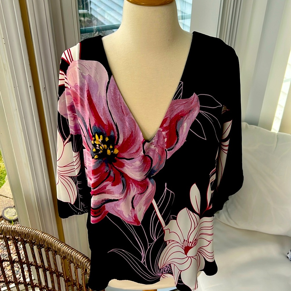 It’s white house, black market, soft blouse size medium, never worn